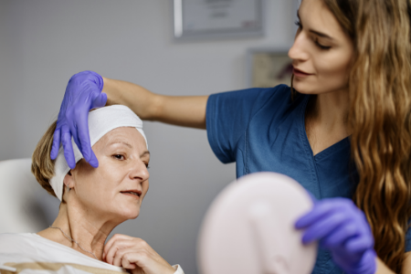 A physician engages with a prospective cosmetic surgery patient.