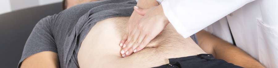 Doctor giving a gastrointestinal examination to a patient