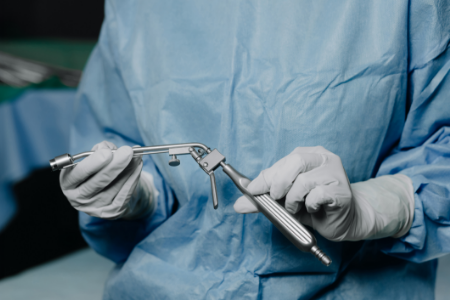 A surgeon holding a urethroscope